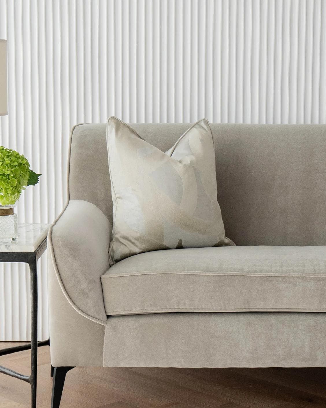 Danya Laurent cushion in silver and beige, shown in a lifestyle front view as image 4