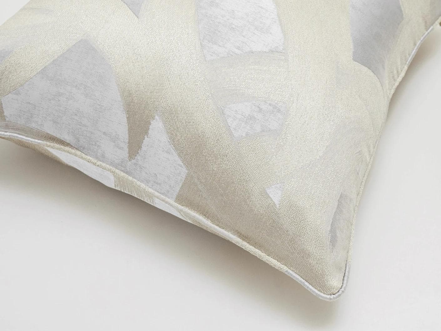 Danya Laurent cushion in silver and beige, shown in a product top view as image 6