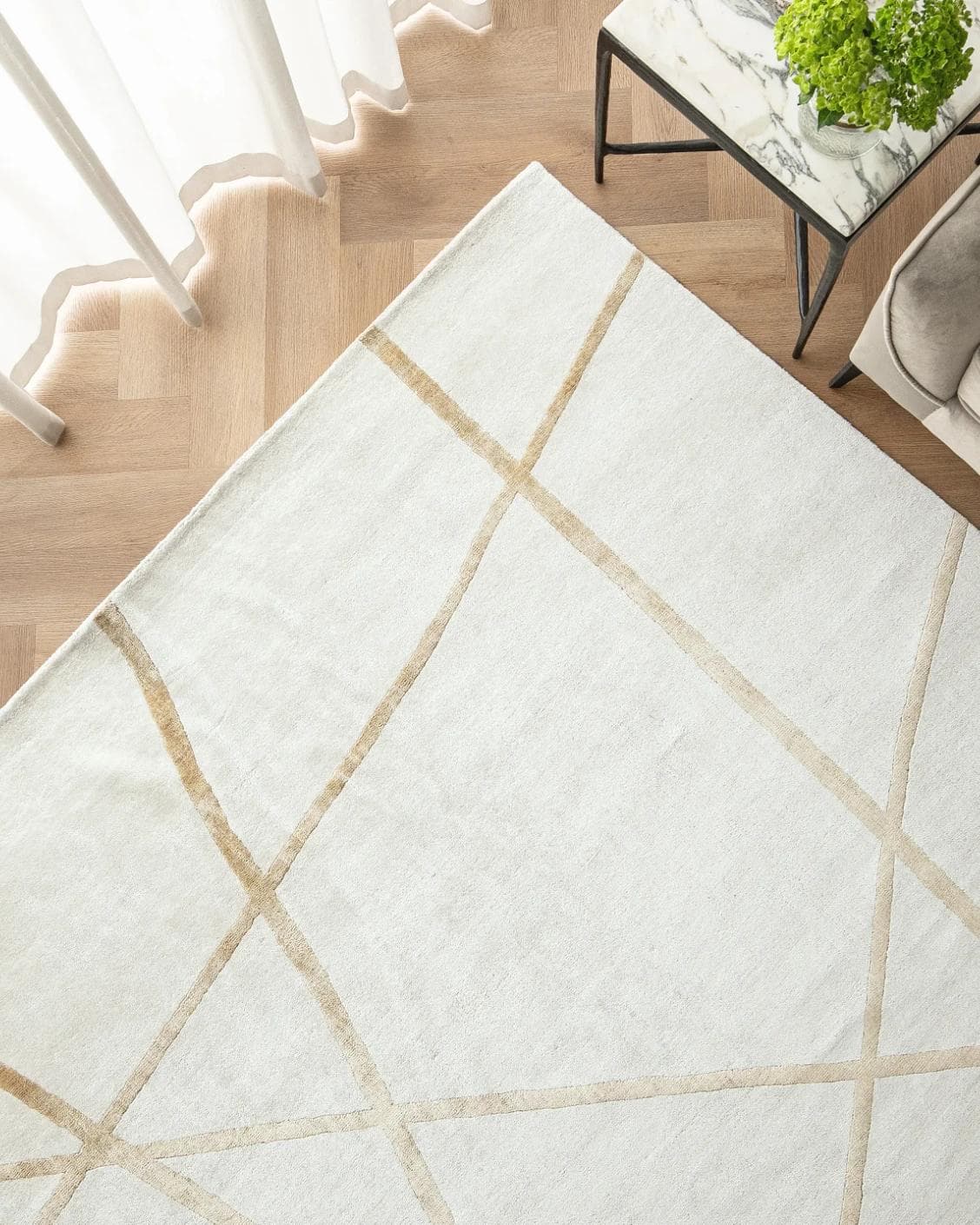 Dash Goldberg carpet in gold and off white, shown in a lifestyle top view as image 2