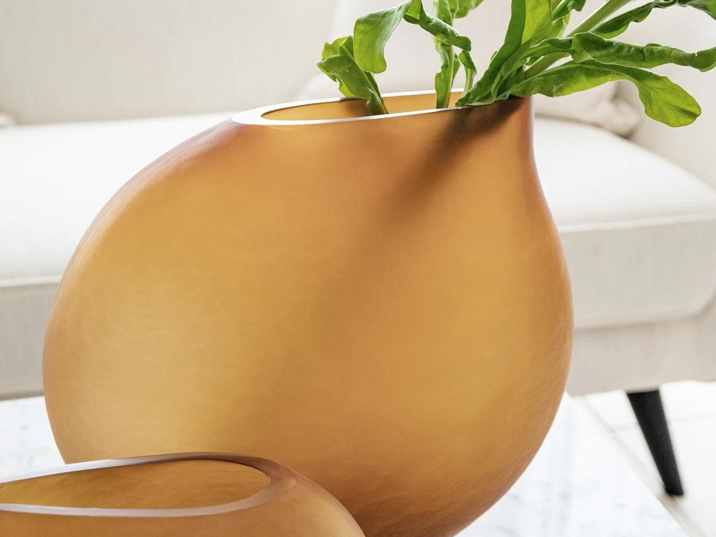 Denise Bundle vases in orange, shown in a lifestyle left view as image 3