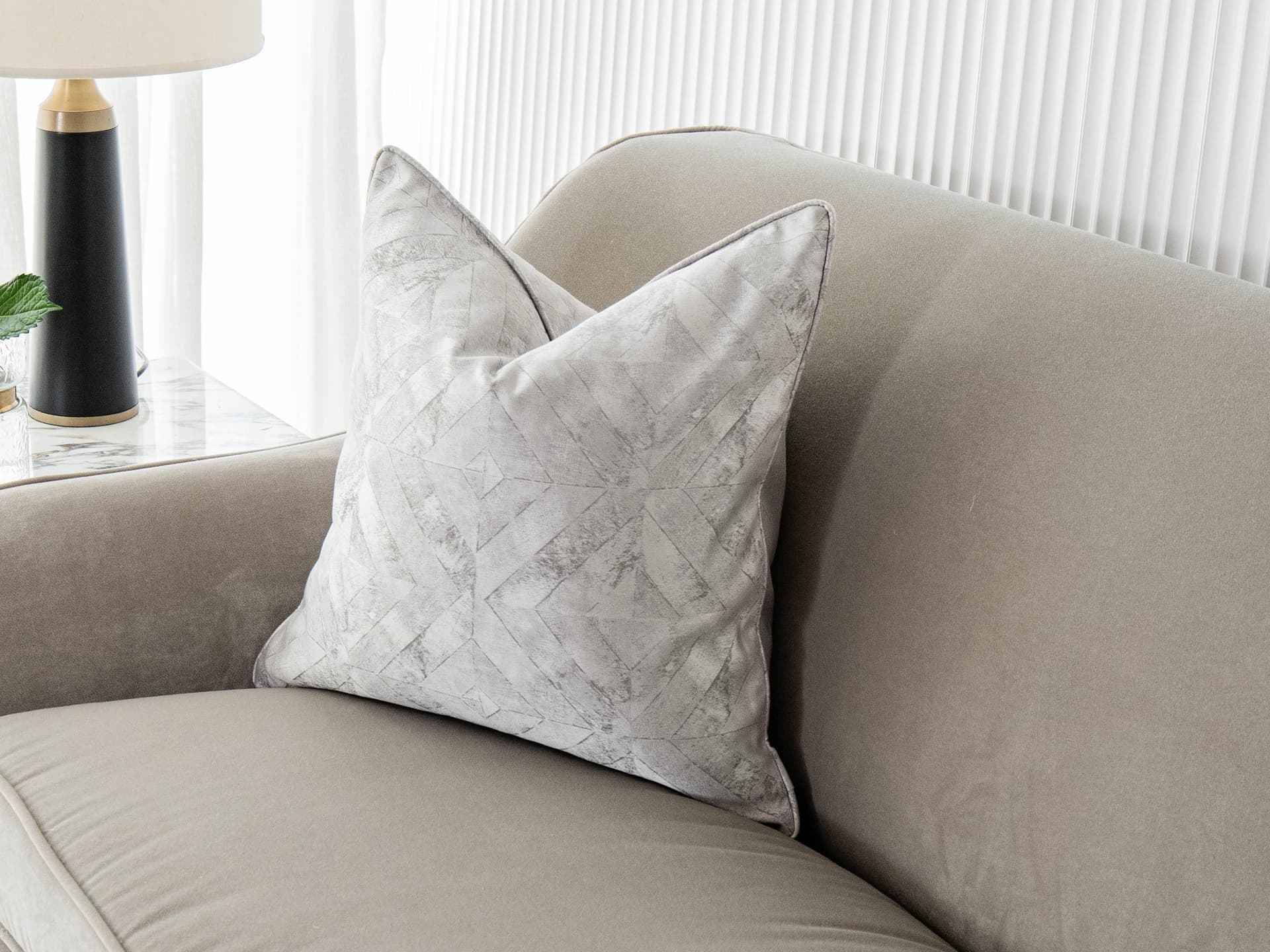 Diana Laurent cushion in silver, shown in a lifestyle right view as image 1