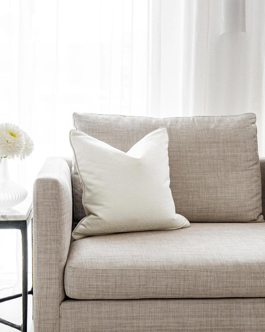 Divina Bianca cushion in white, shown in a lifestyle front view as image 4