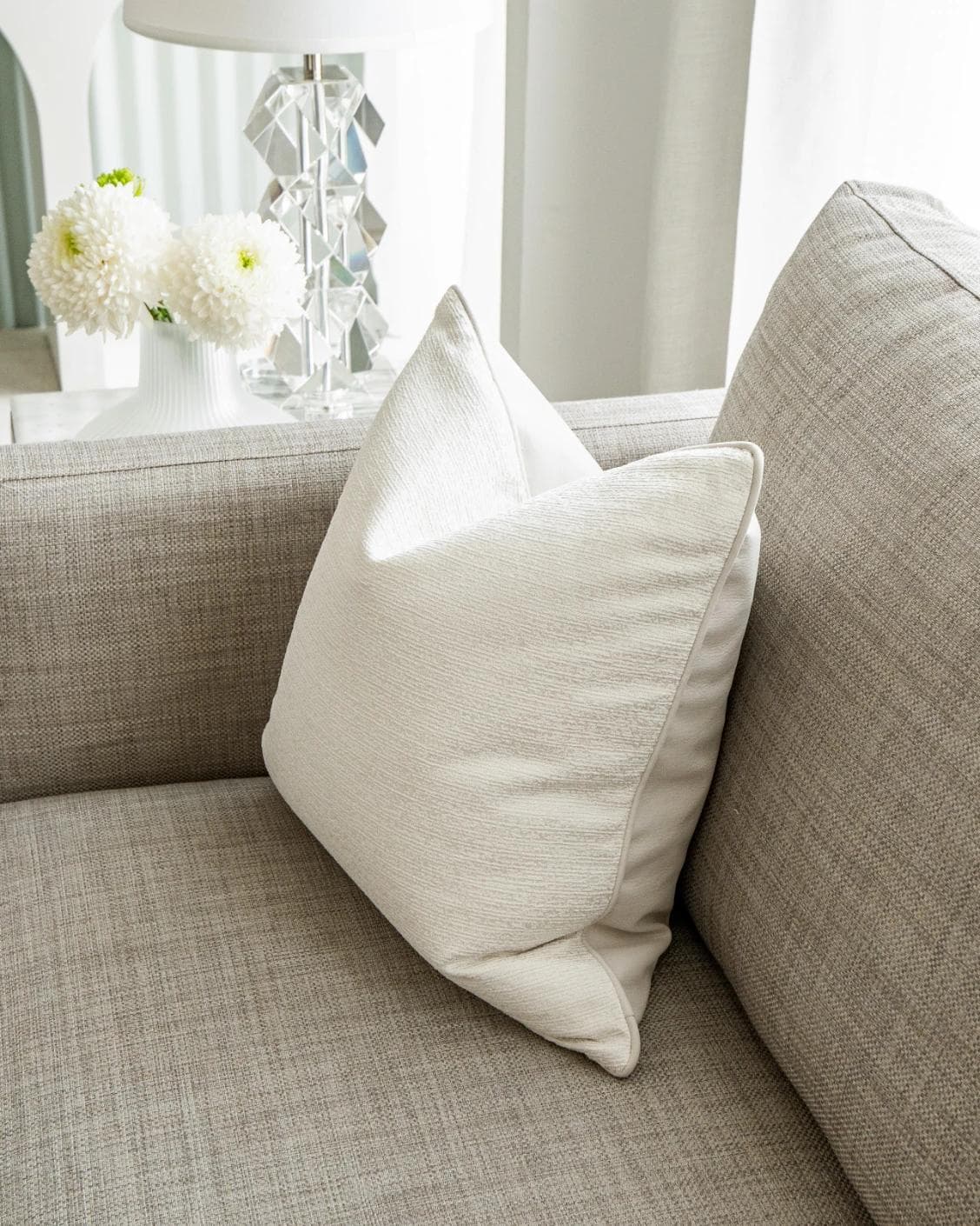Divina Bianca cushion in white, shown in a lifestyle right view as image 5