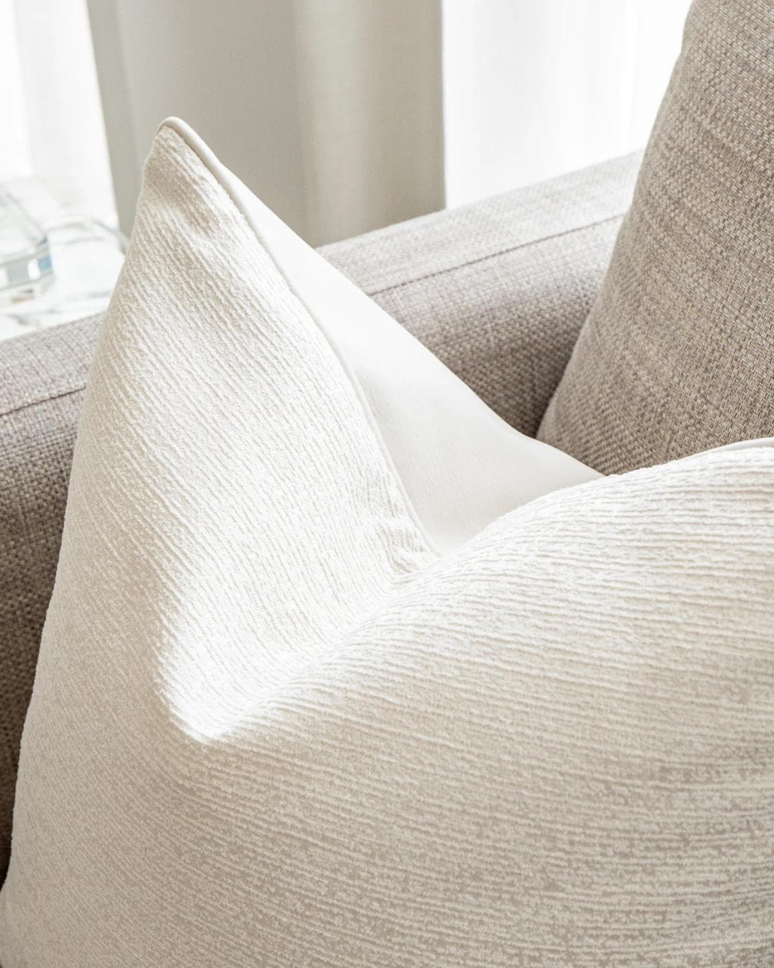 Divina Bianca cushion in white, shown in a lifestyle top view as image 6