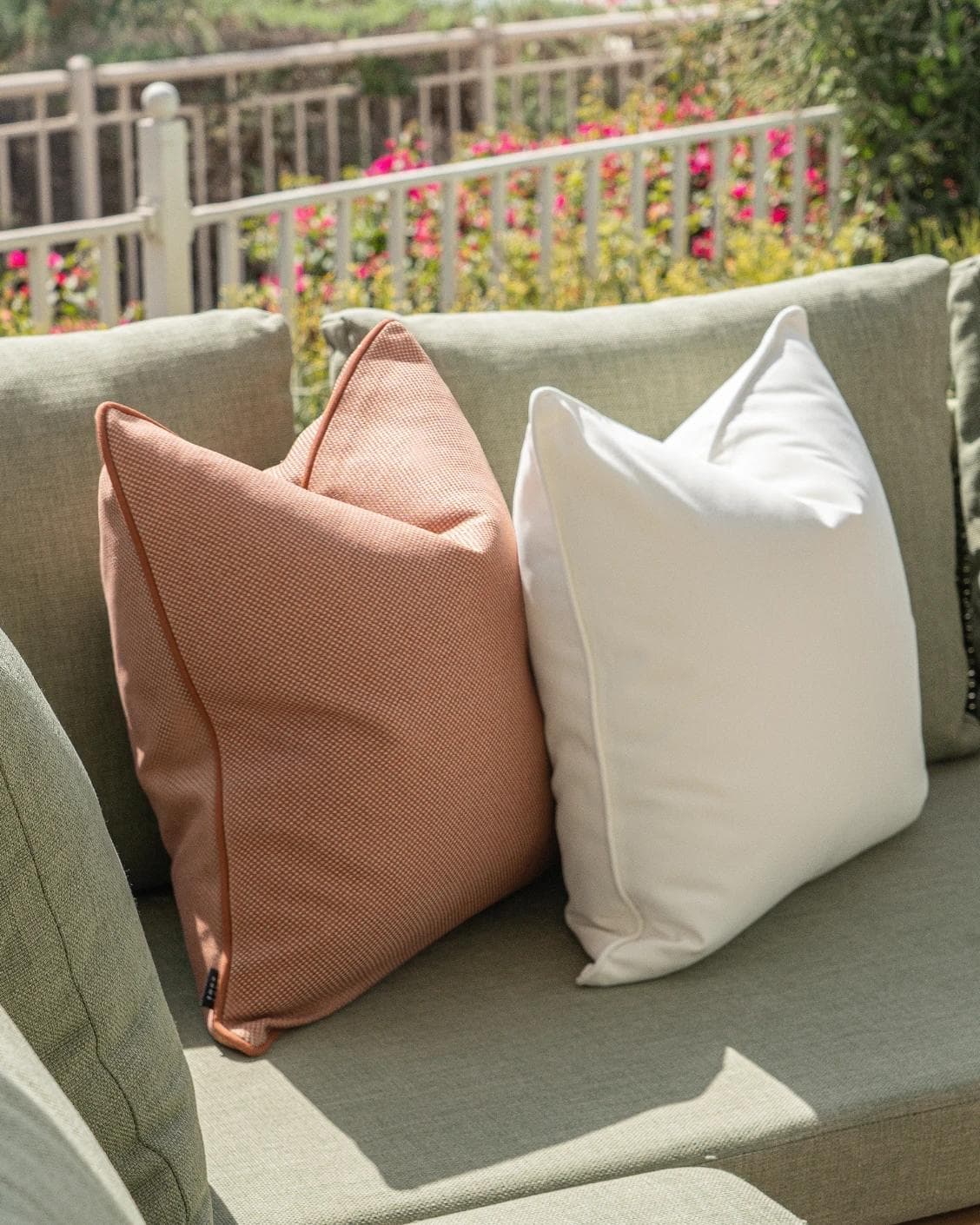 Donya Bundle cushion in ivory and rust, shown in a lifestyle left view as image 6