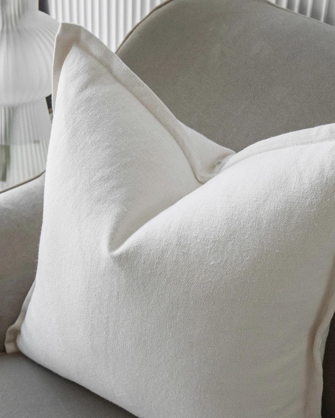 Dorothy Bianca cushion in white, shown in a lifestyle top view as image 5