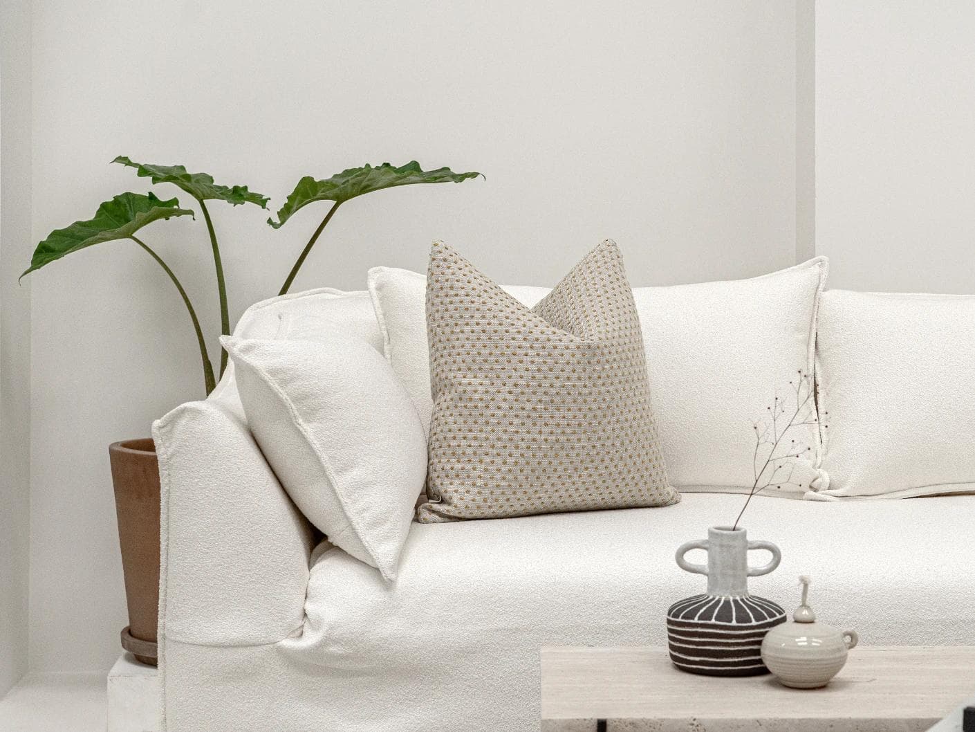 Dotty Barrymore cushion in beige, shown in a lifestyle front view as image 4