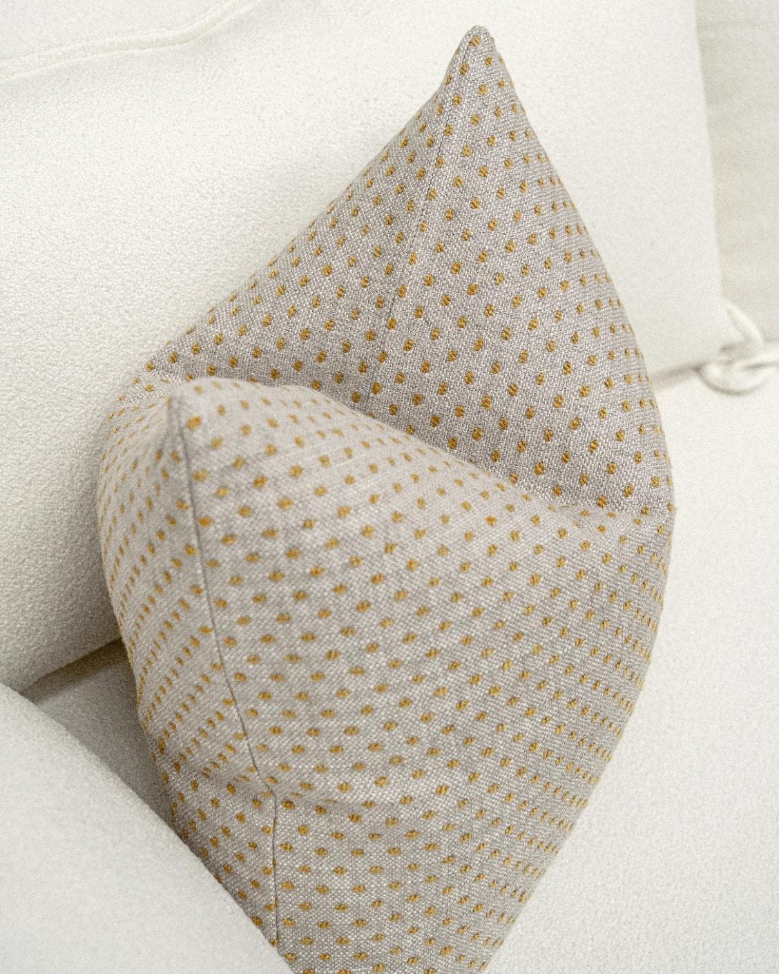 Dotty Barrymore cushion in beige, shown in a lifestyle top view as image 5
