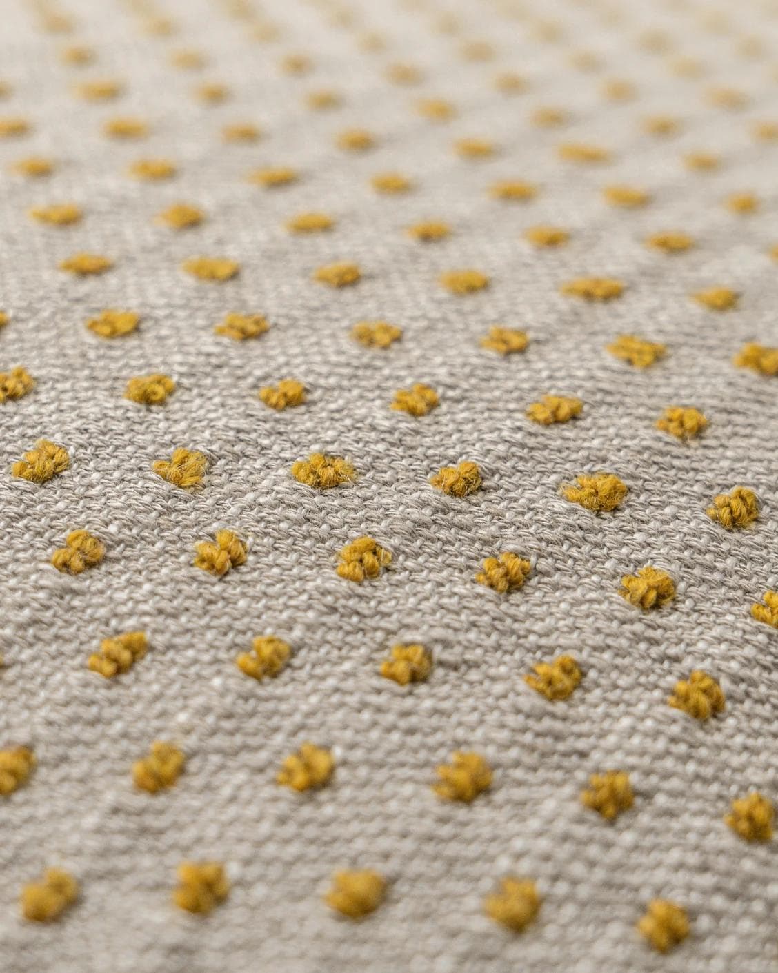 Dotty Barrymore cushion in beige, shown in a product close-up as image 6