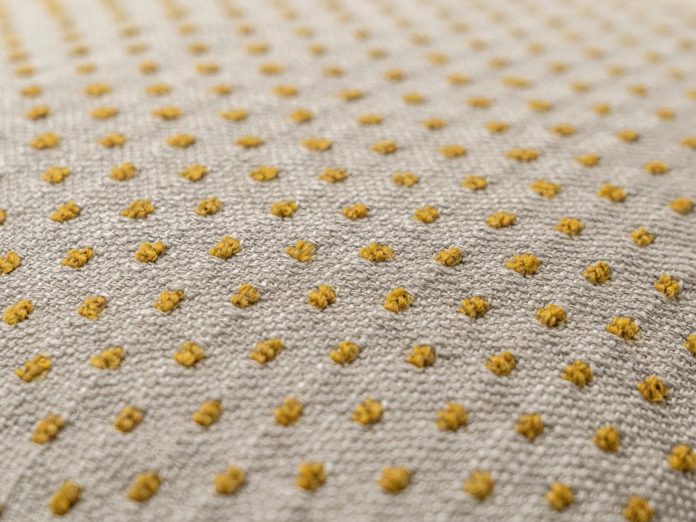 Dotty Barrymore cushion in beige, shown in a product close-up as image 6
