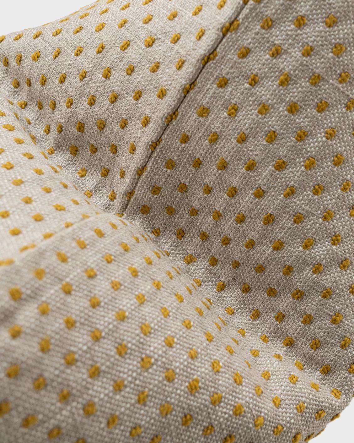 Dotty Barrymore cushion in beige, shown in a product close-up as image 7