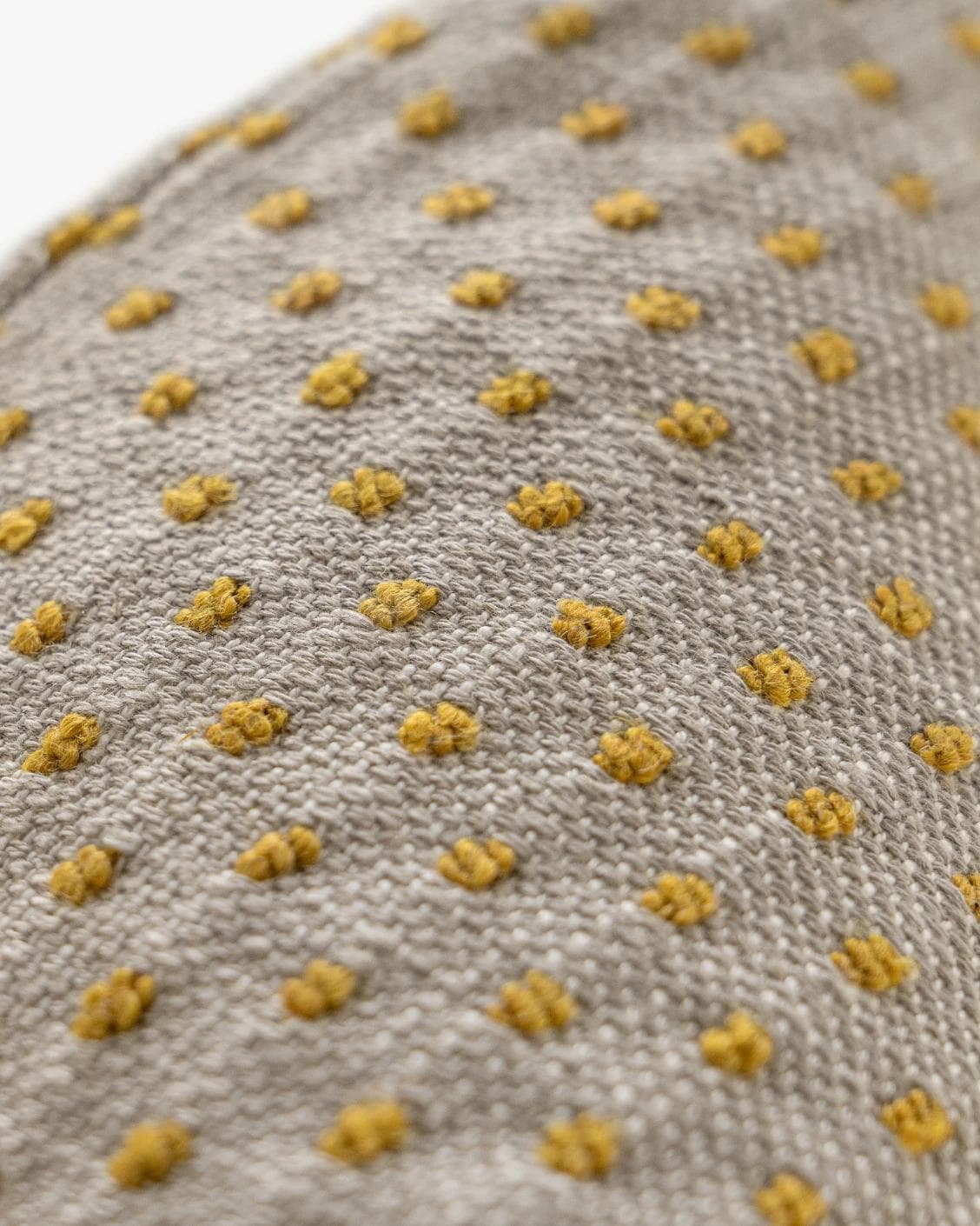 Dotty Barrymore cushion in beige, shown in a product close-up as image 8