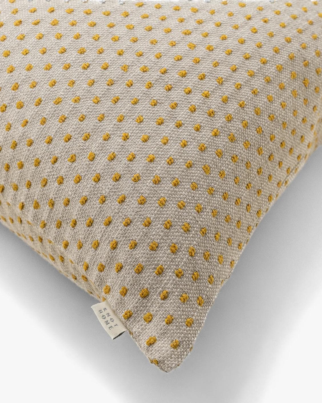 Dotty Barrymore cushion in beige, shown in a product top view as image 9