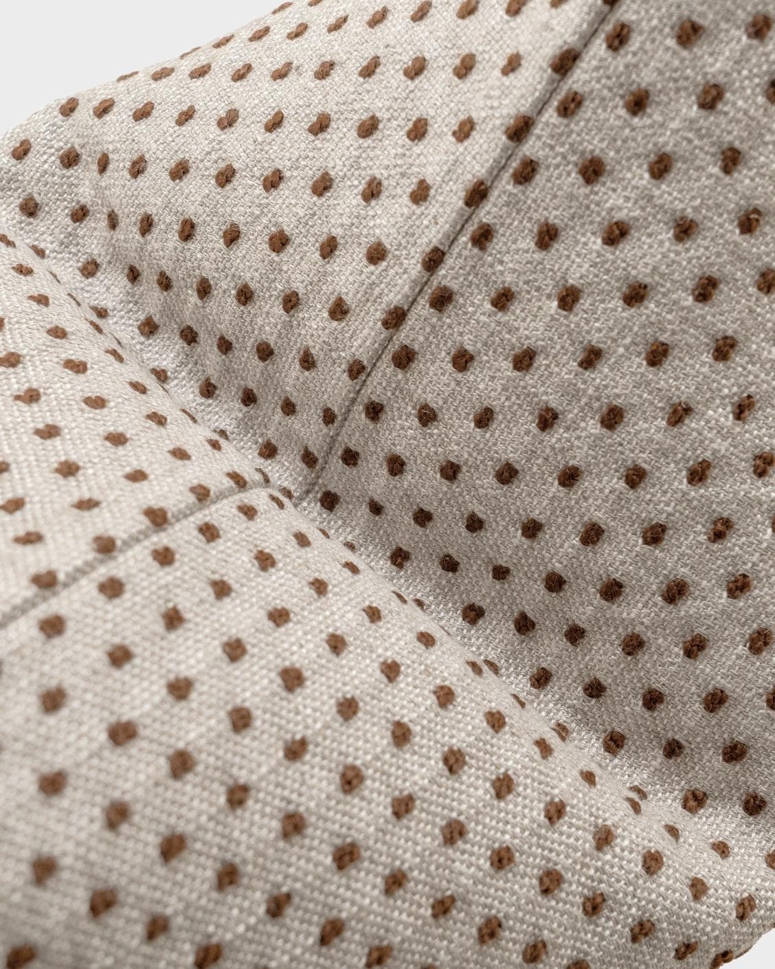 Dotty Rust cushion in beige, shown in a product top view as image 10