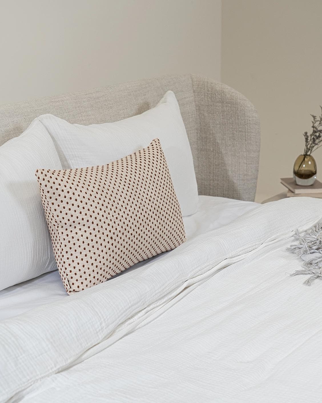 Dotty Rust III cushion in beige and grey, shown in a product left view as image 8