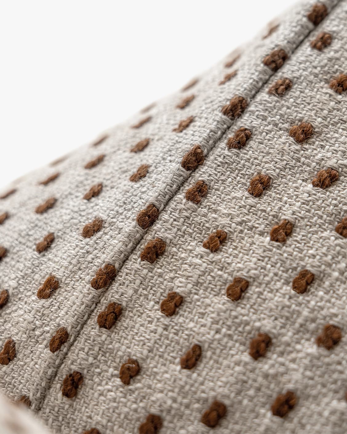 Dotty Rust III cushion in beige and grey, shown in a product right view as image 9