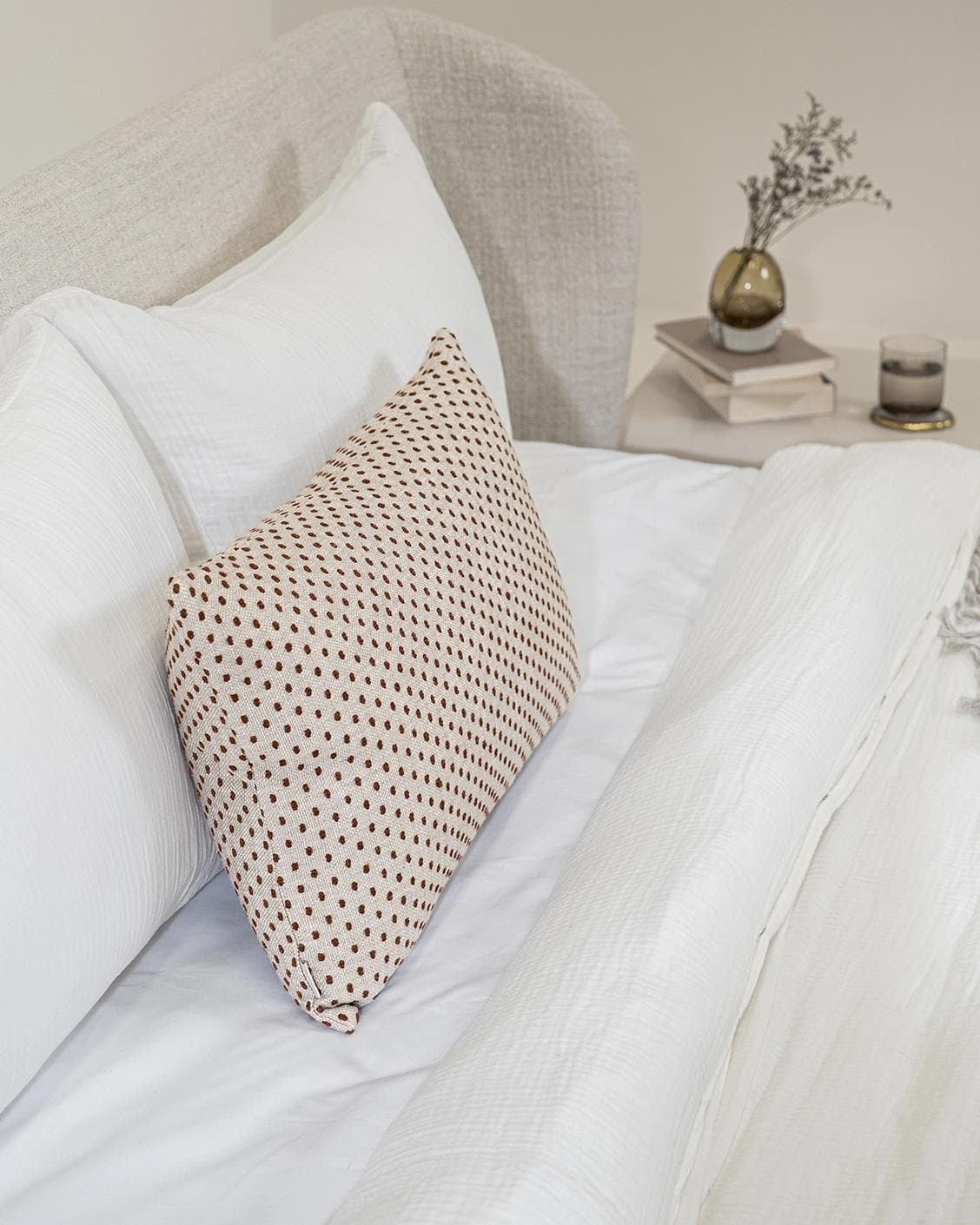 Dotty Rust III cushion in beige and grey, shown in a product right view as image 10