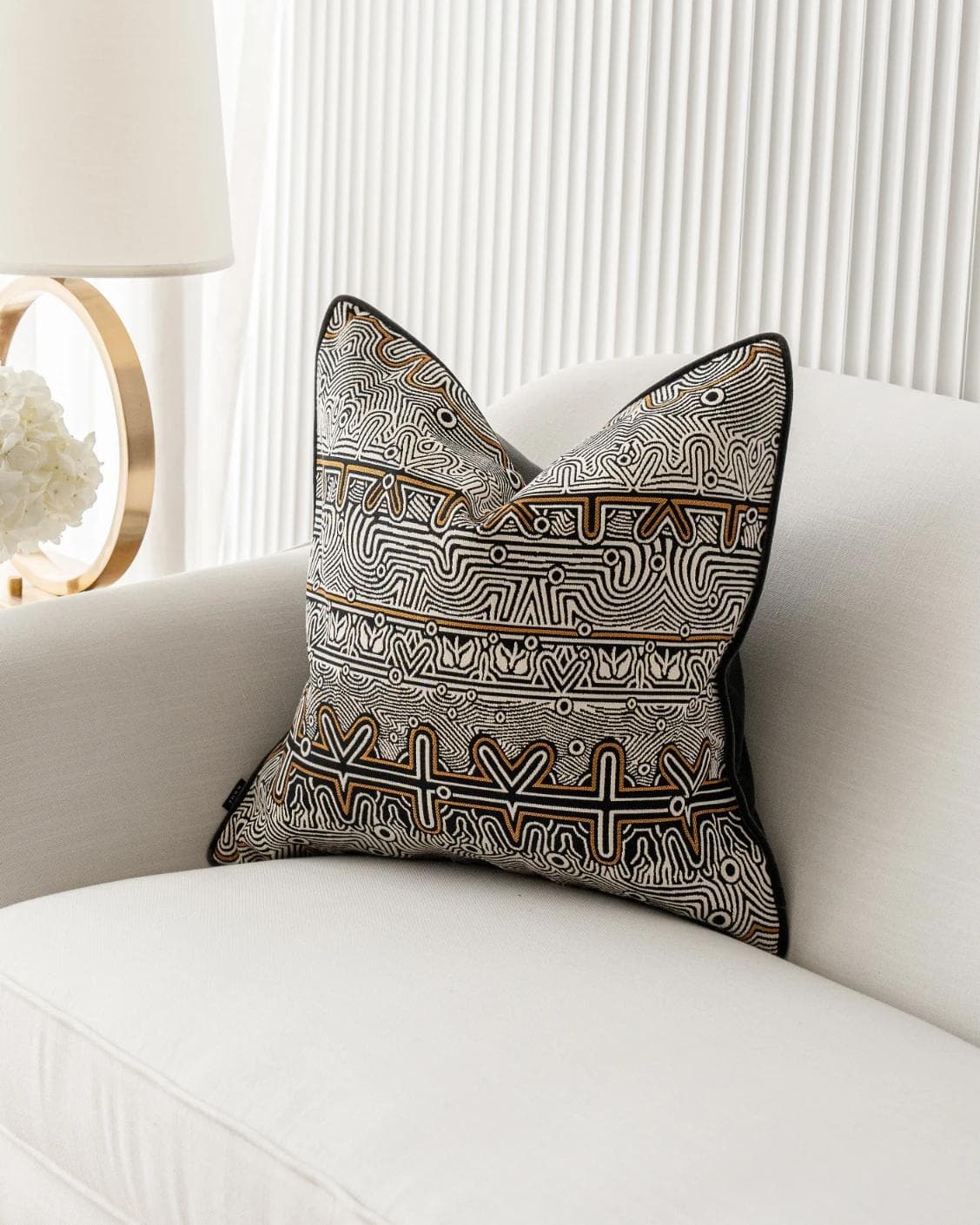 Edda Hodler cushion in black and silver, shown in a lifestyle front view as image 2