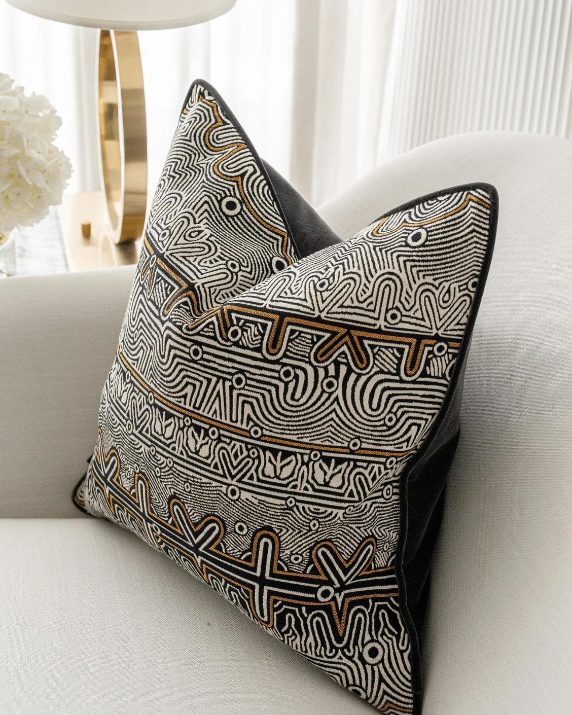 Edda Hodler cushion in black and silver, shown in a lifestyle right view as image 5