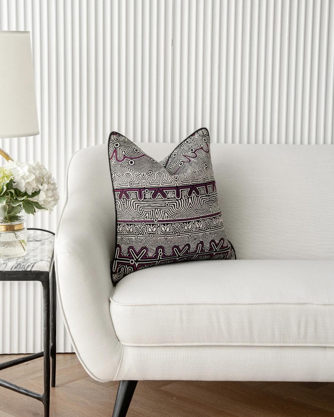Edda Mauve cushion in black and silver, shown in a lifestyle front view as image 1