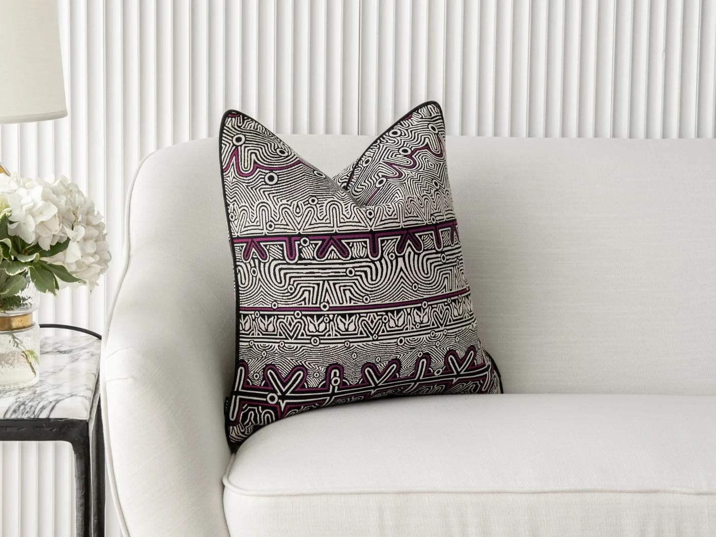 Edda Mauve cushion in black and silver, shown in a lifestyle front view as image 1