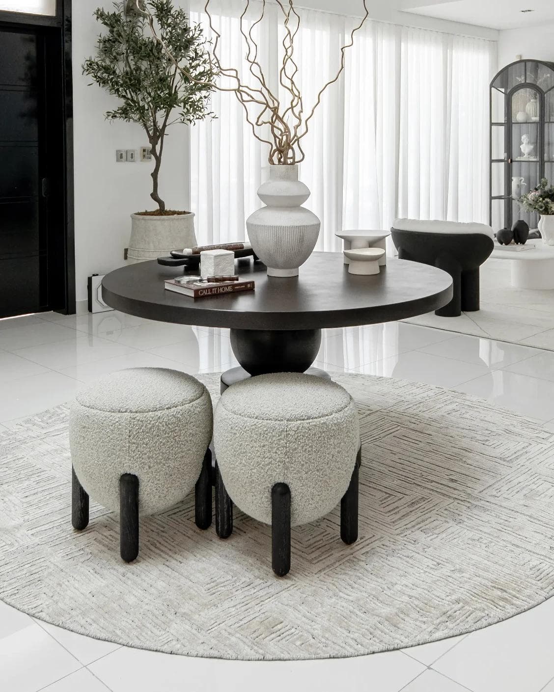 Eh Riley Stone Round carpet in beige, shown in a lifestyle front view