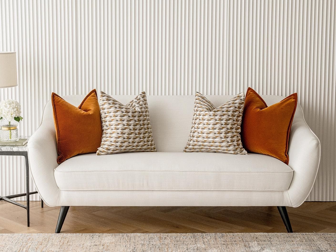 Elda Bundle cushion in rust, shown in a lifestyle front view as image 4