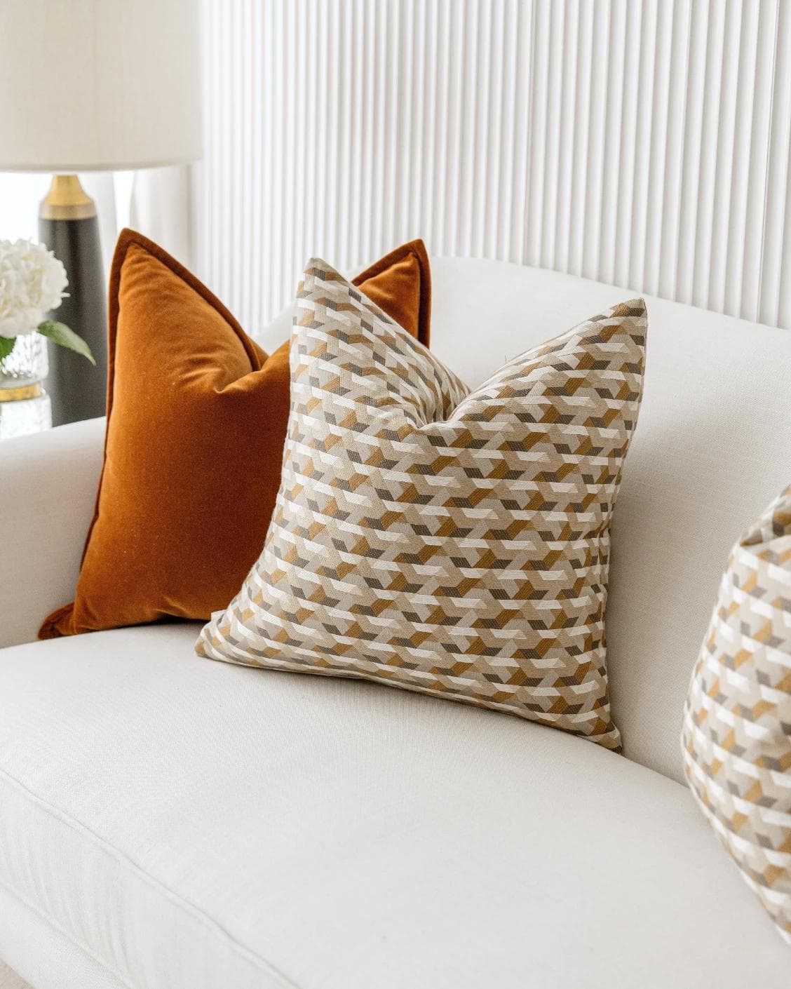 Elda Bundle cushion in rust, shown in a lifestyle right view as image 5