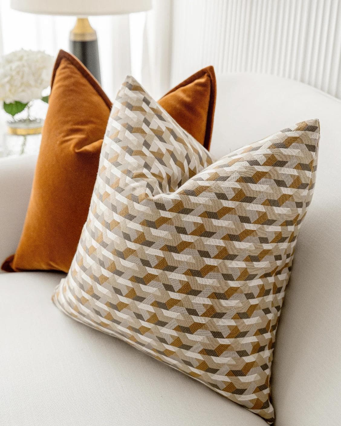 Elda Bundle cushion in rust, shown in a lifestyle right view as image 6