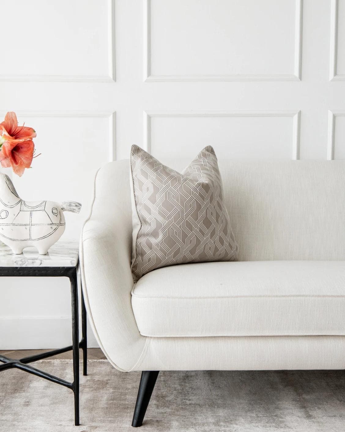 Elena Bianca cushion in beige and white, shown in a lifestyle front view as image 4