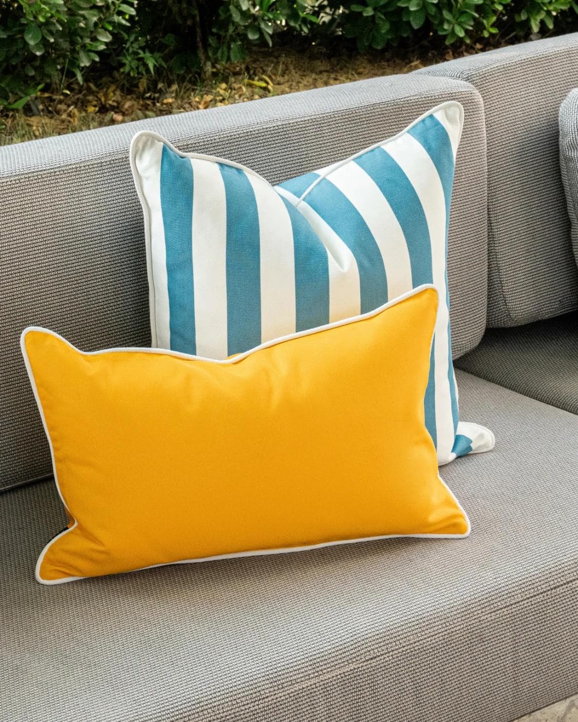 Elio Bundle cushion in turquoise, yellow and ivory, shown in a lifestyle left view as image 4