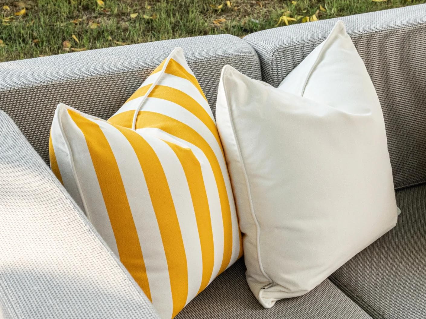 Elio Bundle cushion in turquoise, yellow and ivory, shown in a lifestyle left view as image 5