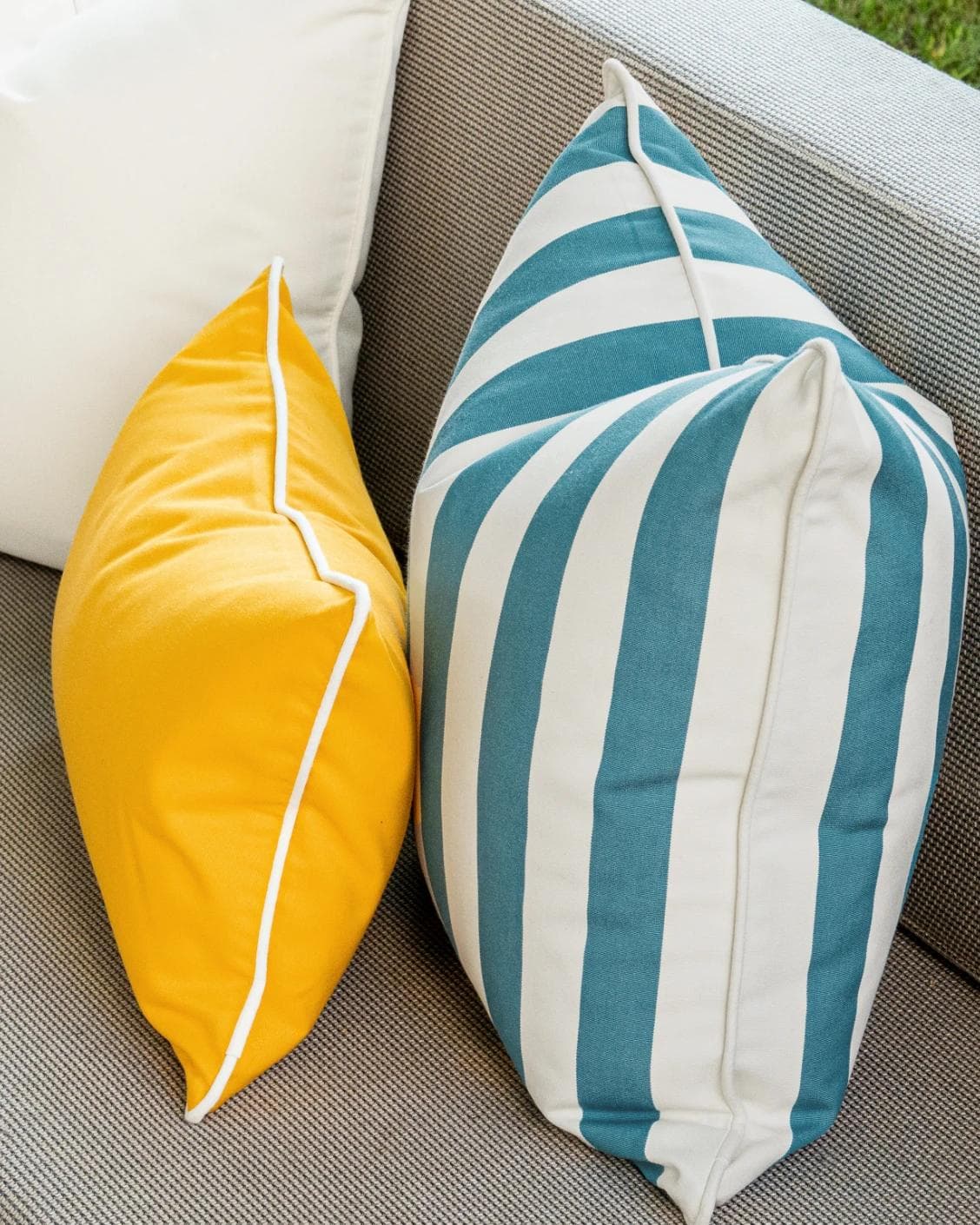 Elio Bundle cushion in turquoise, yellow and ivory, shown in a lifestyle right view as image 7