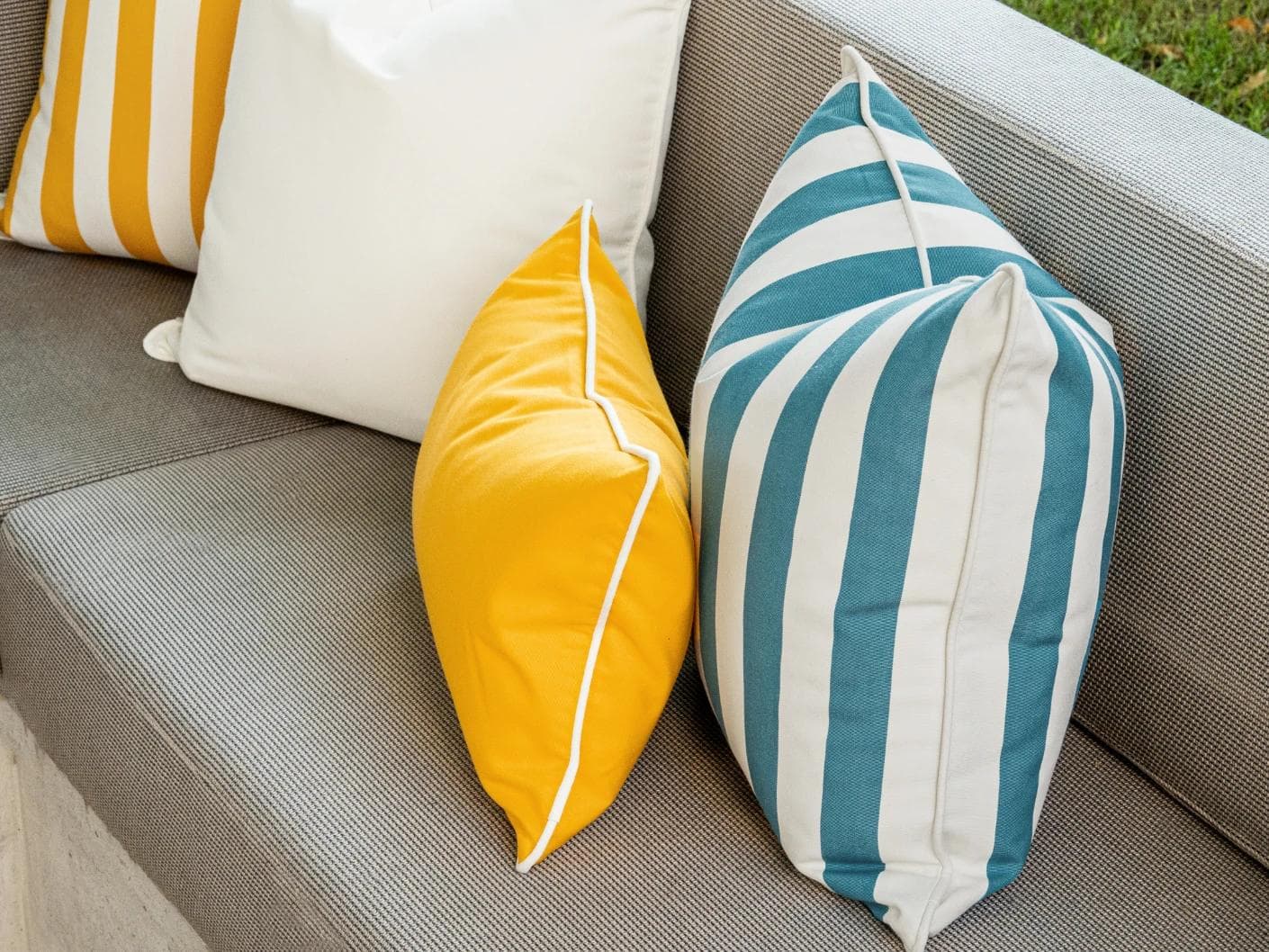 Elio Bundle cushion in turquoise, yellow and ivory, shown in a lifestyle right view as image 7