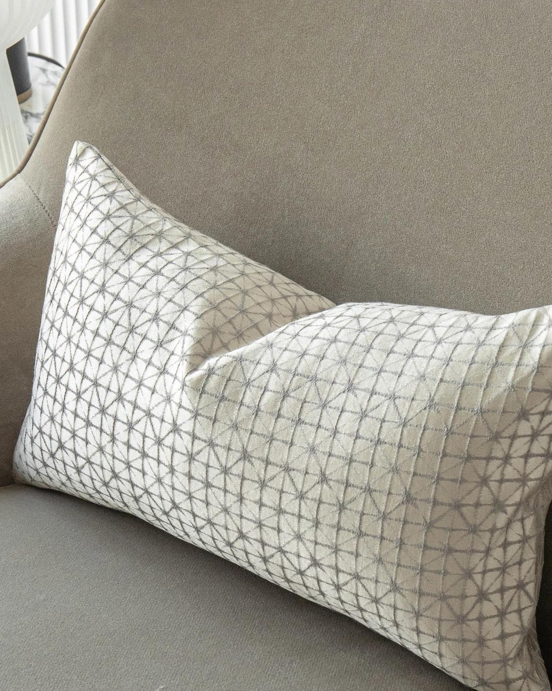 Elmas Klimt II cushion in silver and white, shown in a lifestyle top view as image 5