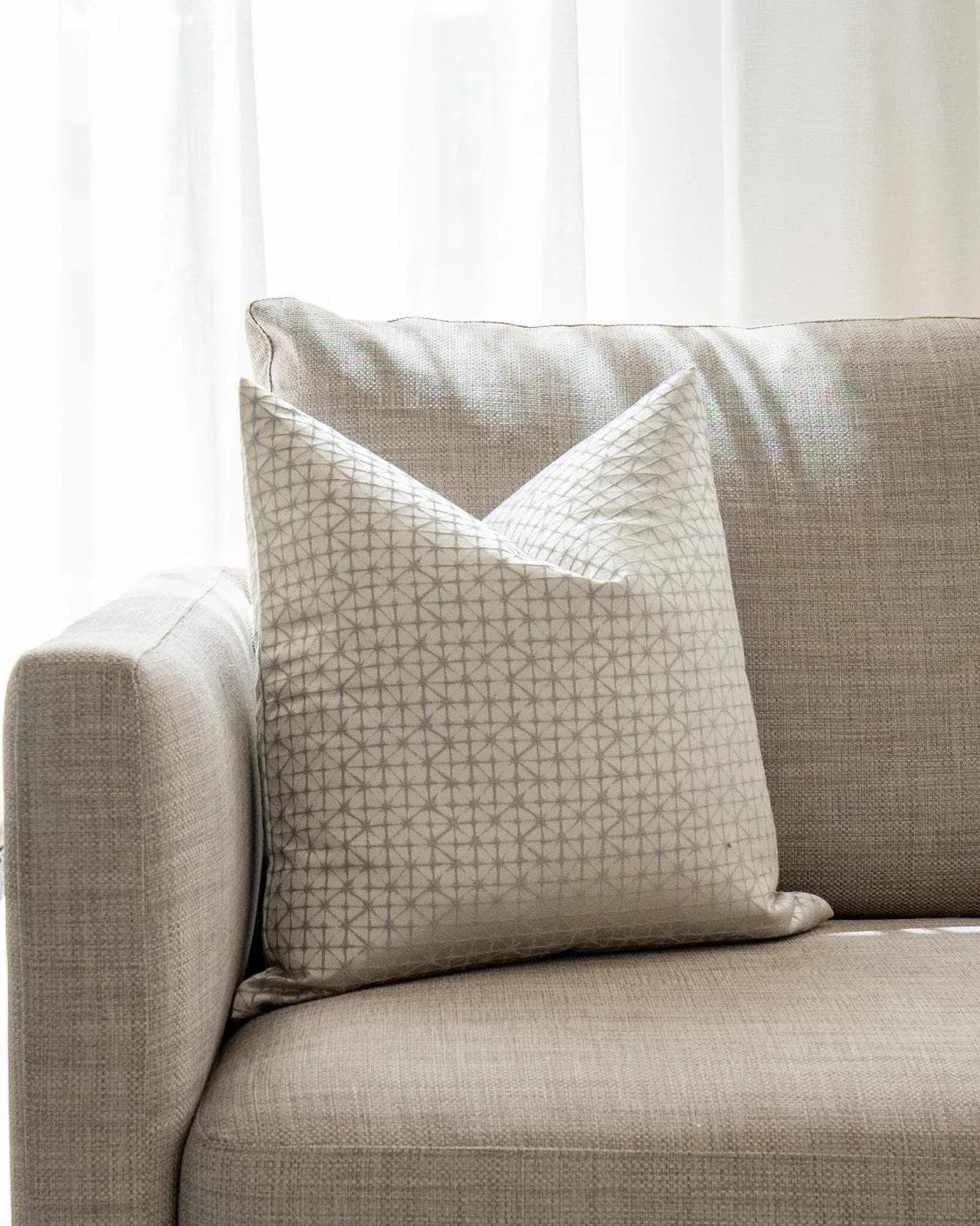 Elmas Klimt cushion in silver and white, shown in a lifestyle front view as image 6