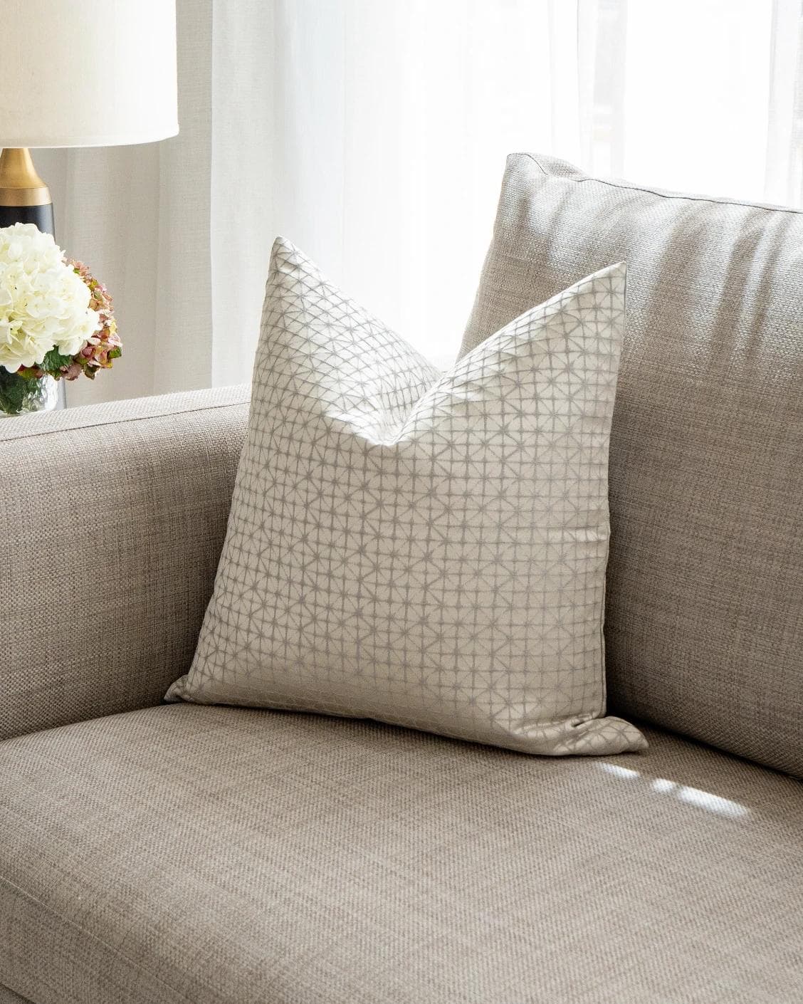 Elmas Klimt cushion in silver and white, shown in a lifestyle front view as image 2