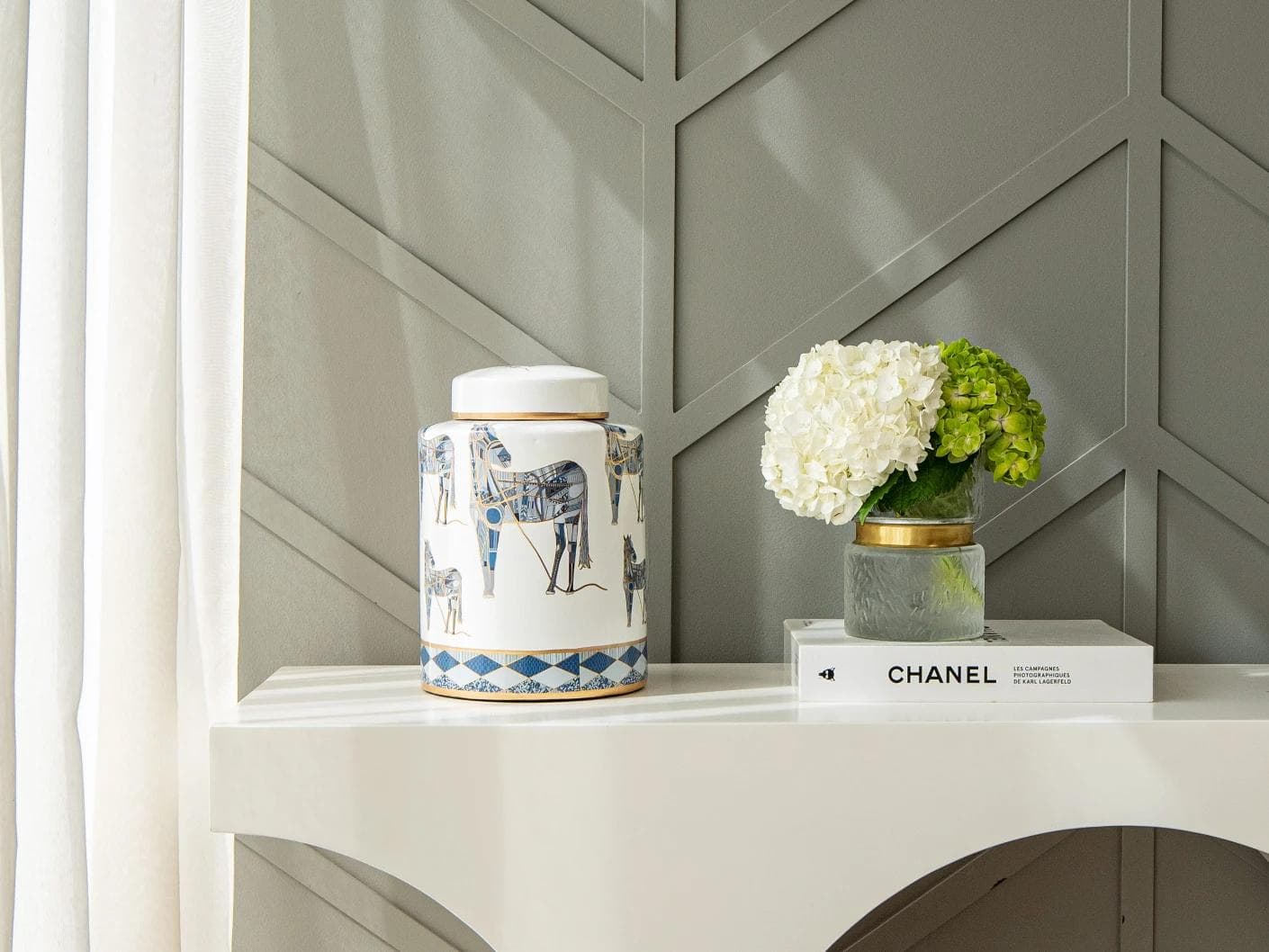 Eloisa Arneson II jars in white and blue, shown in a lifestyle front view as image 3