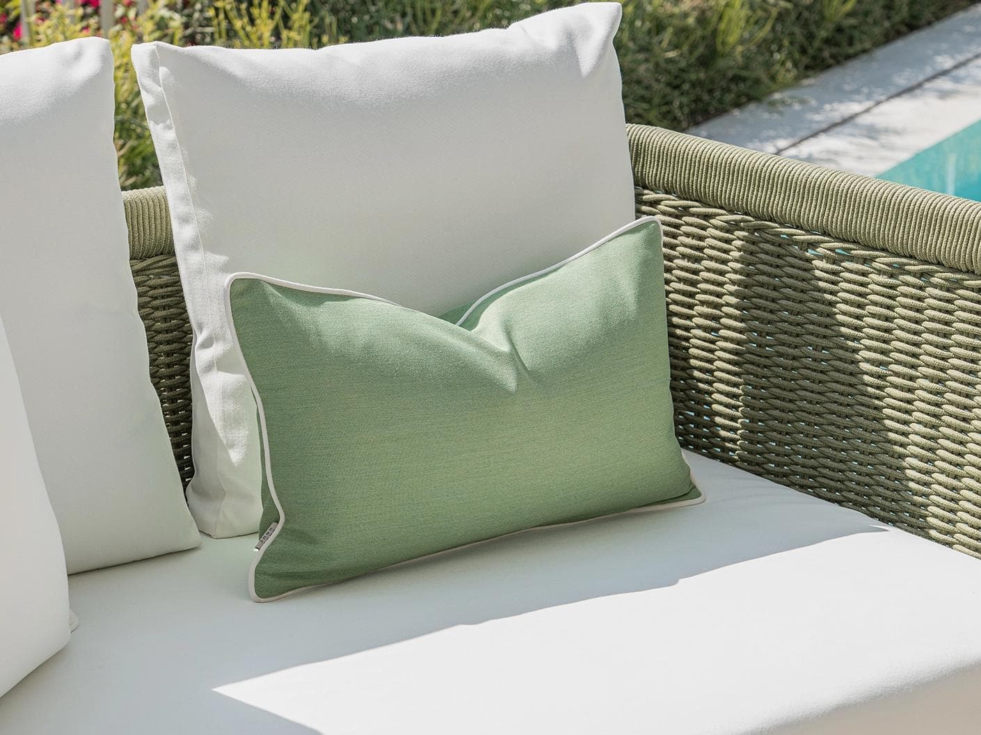 Elovie Bundle cushion in green and ivory, shown in a lifestyle left view as image 5