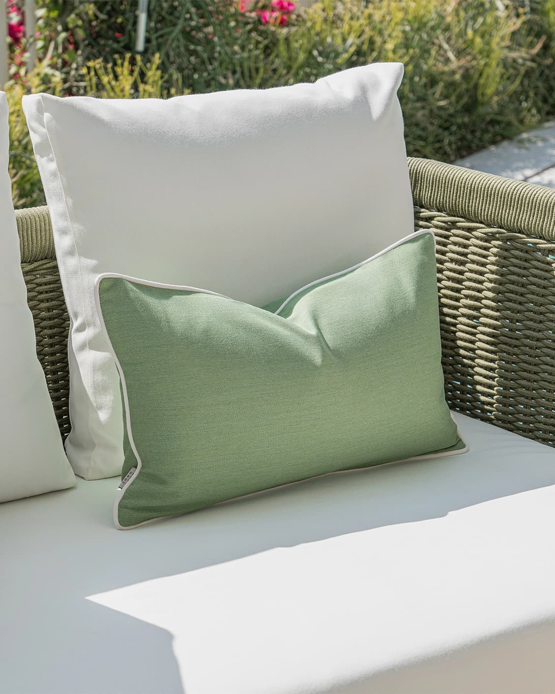 Elovie Bundle cushion in green and ivory, shown in a lifestyle left view as image 5