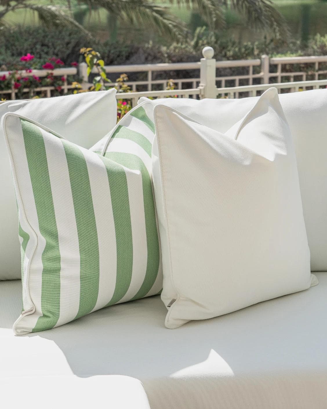 Elovie Bundle cushion in green and ivory, shown in a lifestyle left view as image 6