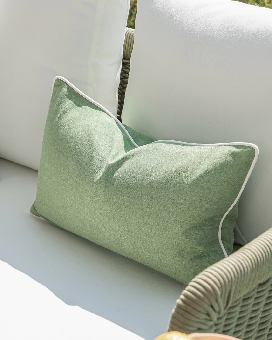 Elovie Bundle cushion in green and ivory, shown in a lifestyle right view as image 7