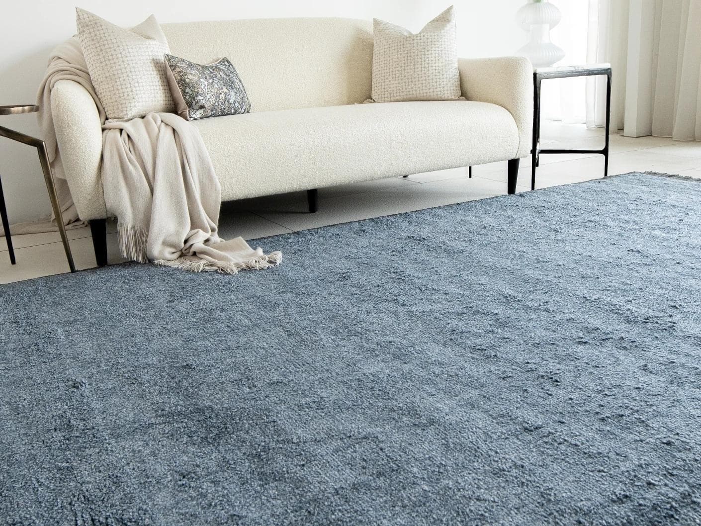 Elyse Sky carpets in blue, shown in a lifestyle left view as image 2