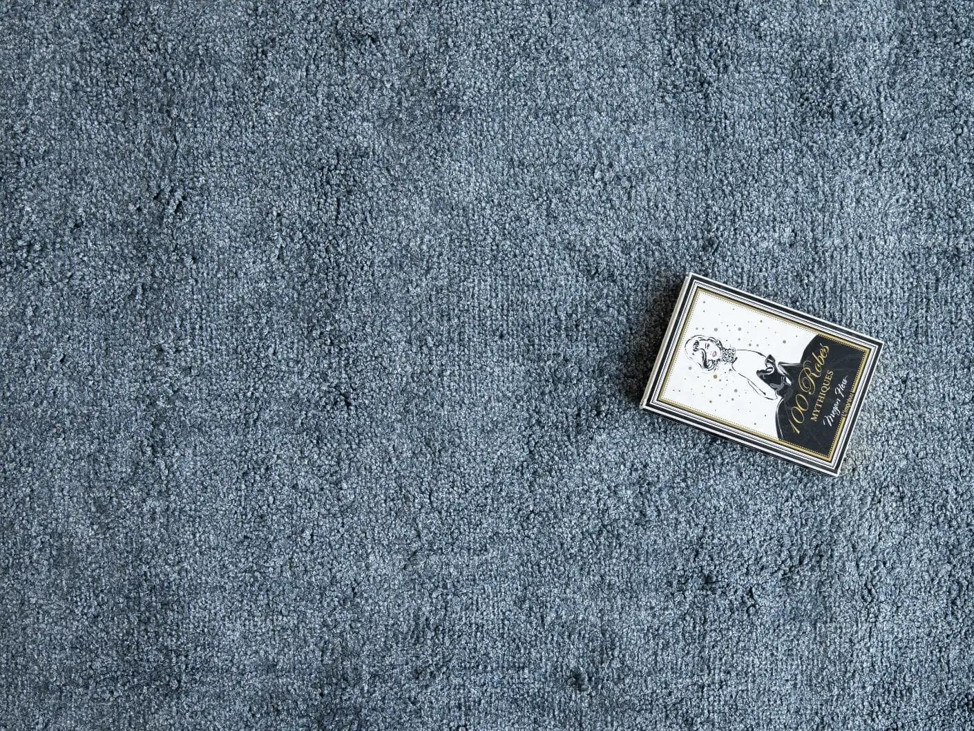 Elyse Sky carpets in blue, shown in a lifestyle top view as image 3