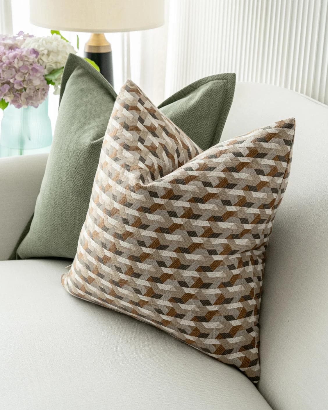 Emmanuela Bundle cushion in orange, beige, white and green, shown in a lifestyle right view as image 7
