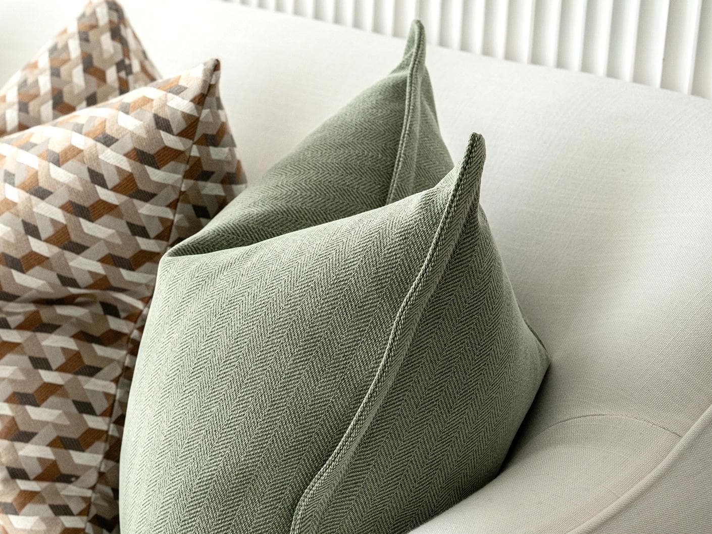 Emmanuela Bundle cushion in orange, beige, white and green, shown in a product right view as image 8