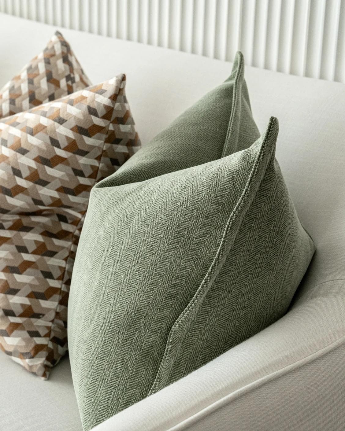 Emmanuela Bundle cushion in orange, beige, white and green, shown in a product right view as image 8