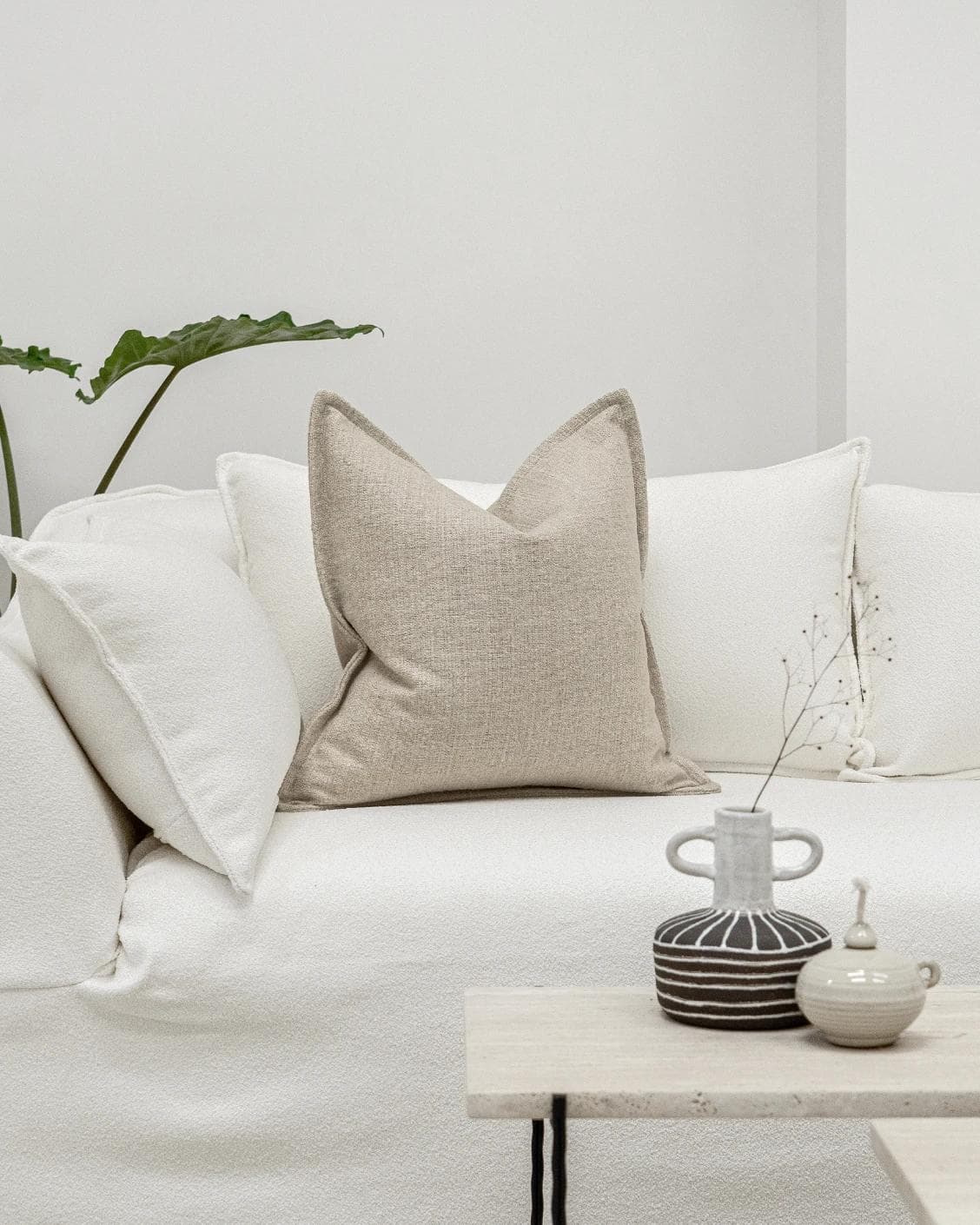 Emmett Alba cushion in beige, shown in a lifestyle front view as image 4