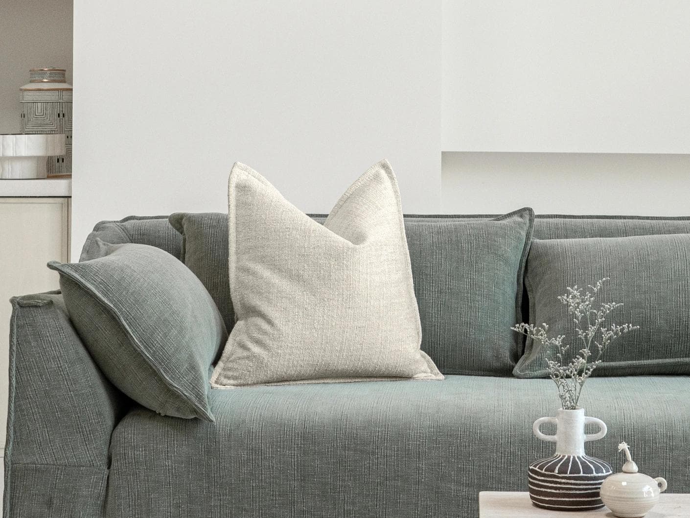 Emmett Bianca cushion in off white, shown in a lifestyle front view as image 4