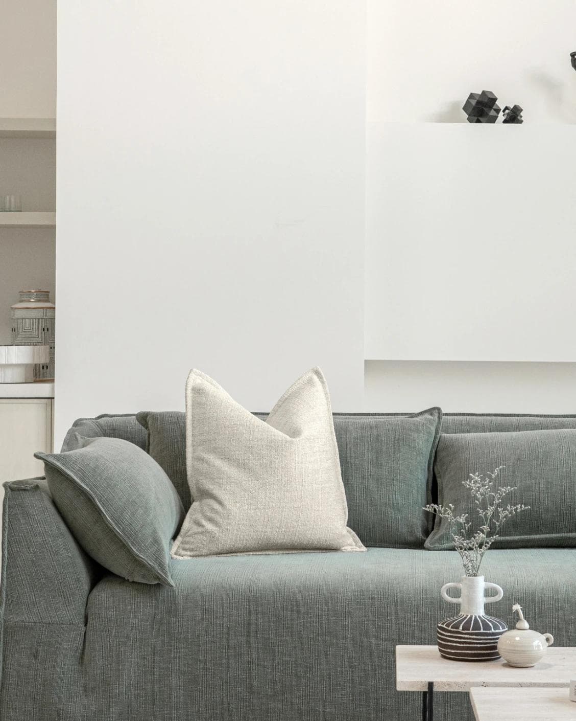 Emmett Bianca cushion in off white, shown in a lifestyle front view as image 4